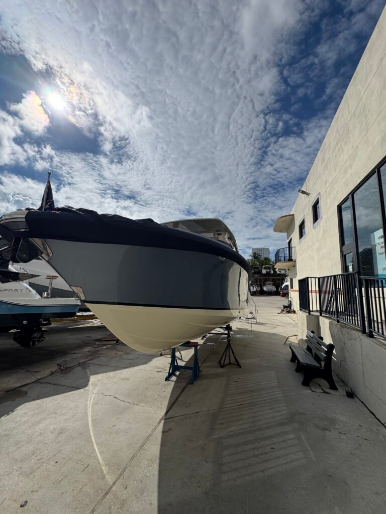 Boat on stands in the yard at Loggerhead Hi-Lift Marina, Aventura, ready for a washdown