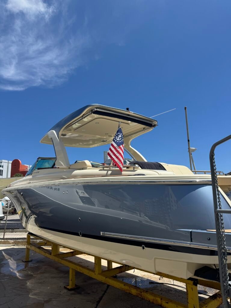 Center console with T-top on the cleaning rack at Loggerhead Hi-Lift Marina, Miami