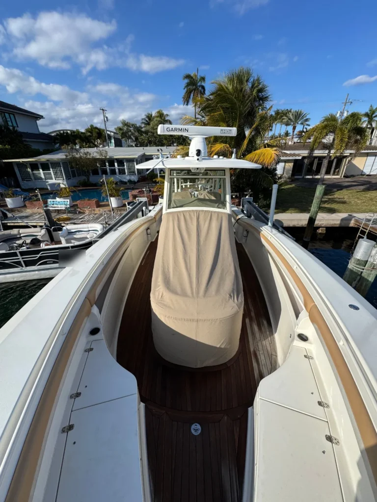 Center console with teak deck and console cover, docked on a canal in South Florida