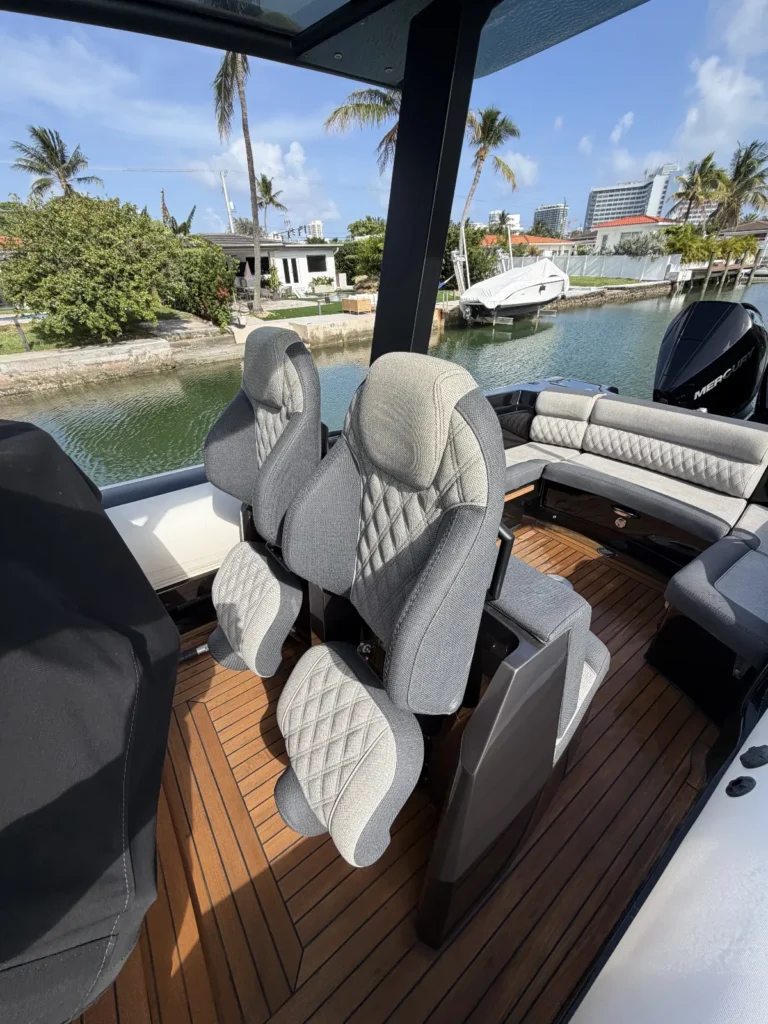 Dayboat helm seats and teak cockpit floor on a Miami canal