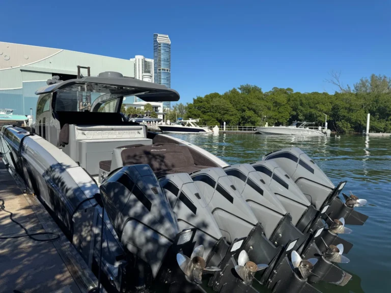 Midnight Express center console with six outboard engines docked at a Miami marina